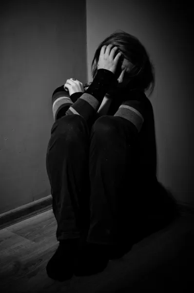depositphotos_19884131-stock-photo-sad-woman-sitting-alone-in